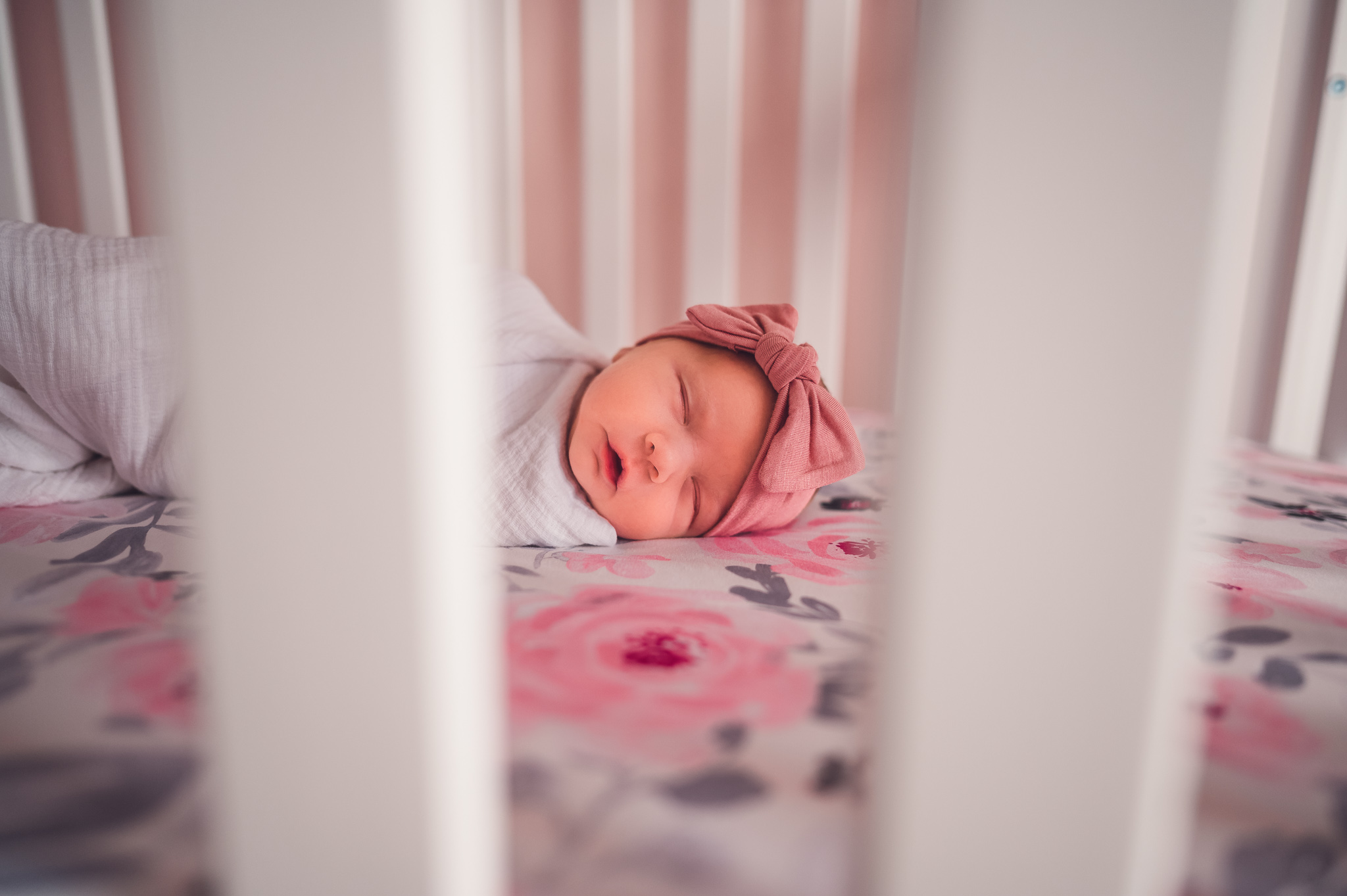 Baby girl in crib