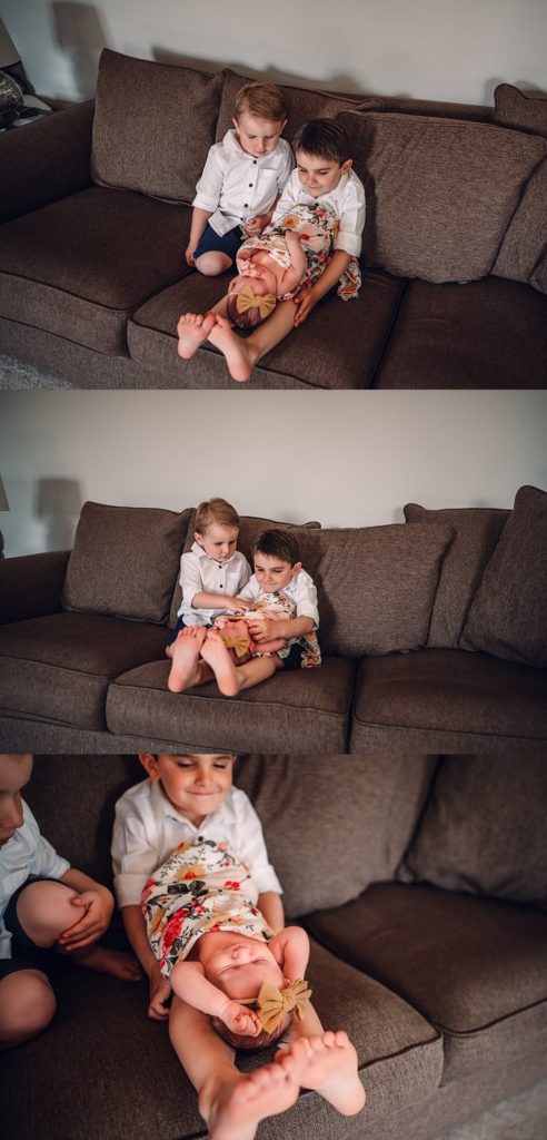in-home newborn session with big brothers holding baby sister
